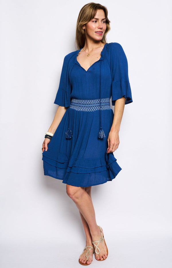 V-neck with tie Smocked waist for a tailored fit Flowy ruffle sleeves and hem blue dress french fashion - volange paris